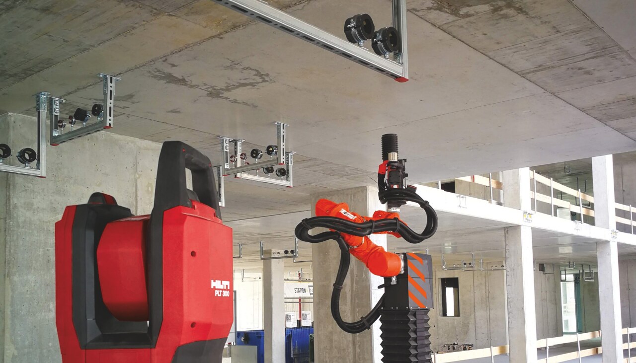 MEP installation system, total station and drilling robot on a construction site